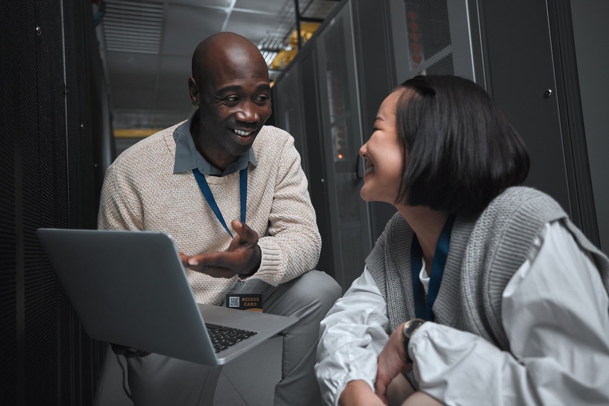 IT Professionals collaborating in a server room environment